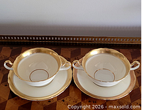 Overall view of both cups and saucers showing pattern and condition