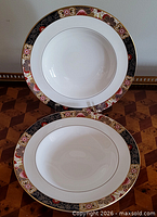 Two Royal Worcester rim-soup bowls front view