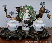 Full view showing porcelain figure, two inkwells, bronze base and candleholder