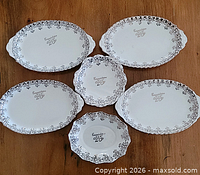Underside of all six dishes showing pattern name and maker’s mark