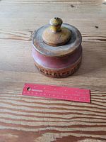 Top view of spice box beside ruler for scale