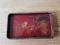 Top view of rectangular red lacquer tray with bird and blossom design