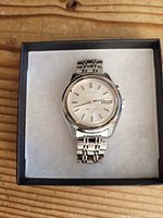 Front view of Seiko Bell-Matic watch in box showing dial and bracelet