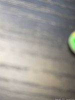 Context photo including partial view of gemstone