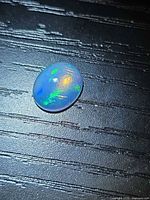 Top view of opal showing size and play-of-color