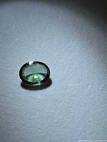 Top view of mint green oval apatite