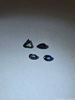 All four sapphires showing shapes and colours