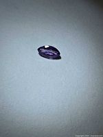 Faceted marquise purple sapphire top view