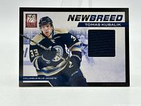 Front of card showing player image, patch, titles and brand logo