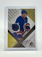 Front of card showing player image, jersey swatch and serial number 343/399