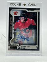 Front view of autographed Spencer Foo rookie card in case