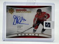 Front of sealed Garrett Pilon autograph card showing signature, player image and subset branding