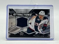 Front of card showing jersey swatch, player image, numbering