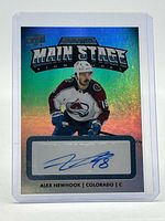 Front view of the autographed Alex Newhook Main Stage Signatures card in holder