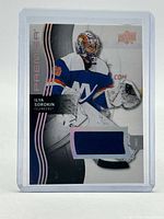 Front of card displaying image, branding and jersey patch