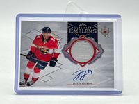 Front of Justin Sourdif Ultimate Emblems card in top loader