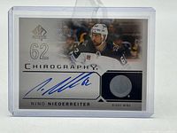 Front of autographed Nino Niederreiter SP Authentic Chirography card in holder