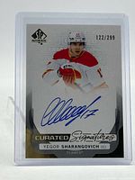 Front of card showing image, blue autograph, serial number 122/299