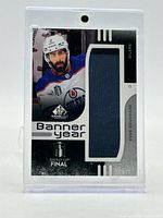 Front view of Evan Bouchard Banner Year Patch card in holder
