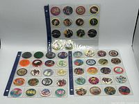 overview of three album pages with POG caps