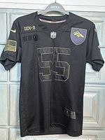 Front view showing number 55, patches, and overall condition