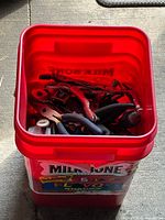 Top view of bucket filled with assorted hand tools