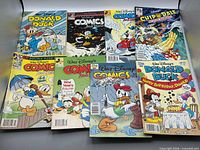 All eight Disney comic books laid out