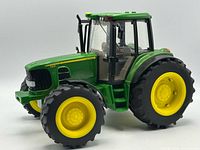 Front and side view of John Deere 7330 model tractor
