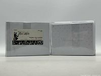 Front view of both sealed card sets