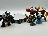 Group shot of all Skylanders figures and portal