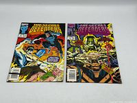 Both comic books front covers visible