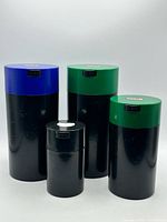 Front view of all four TightVac canisters showing size and lid color