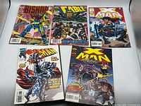 All five comic books laid out for overview