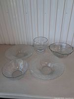 Full lot showing five glass pieces