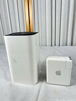 Front view of both routers showing cosmetic wear