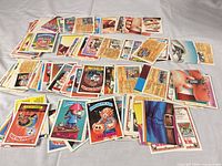 Wide view of entire spread of Garbage Pail Kids cards