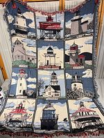 Full view of woven lighthouse throw with fringe