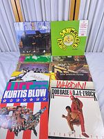 Group shot of approximately ten 12-inch records laid out