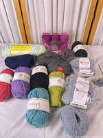 Group shot of entire yarn lot showing brand labels and colour variety