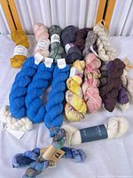 Overall view of all skeins laid out on table showing quantity, colors and labels