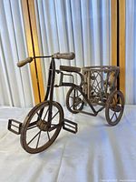 Full view of metal and wood tricycle planter
