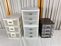 Three Sterilite drawer organizers side by side showing overall condition