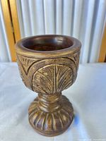 Full view of carved wood gilt pedestal urn