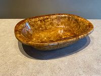 Full view of oval brown-mottled bowl