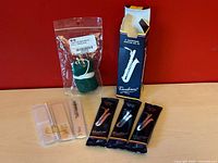 All reeds and swab grouped on tabletop