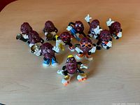 Group of 11 California Raisins figurines in various poses