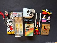 All items in lot arranged on black background