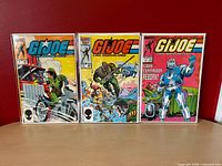 Front view of all three bagged G.I. Joe comics issues 44, 56, 58