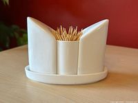 Set assembled showing toothpick holder flanked by shakers on tray