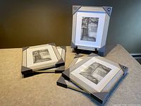 Five packaged Home Trends frames displayed, showing front design and protective corners